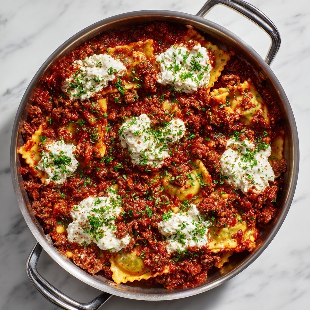 A close-up of a large pot filled with cooked lasagna pasta pieces partially submerged in a thick, rich red tomato sauce with visible ground meat mixed in; on top, there are multiple dollops of white ricotta cheese spread evenly across the surface with grated cheese sprinkled over them. Fresh green parsley leaves are scattered across the top, adding color contrast. The pot has red handles and sits on a white marbled surface. Photo taken with an iphone --ar 4:5 --v 7