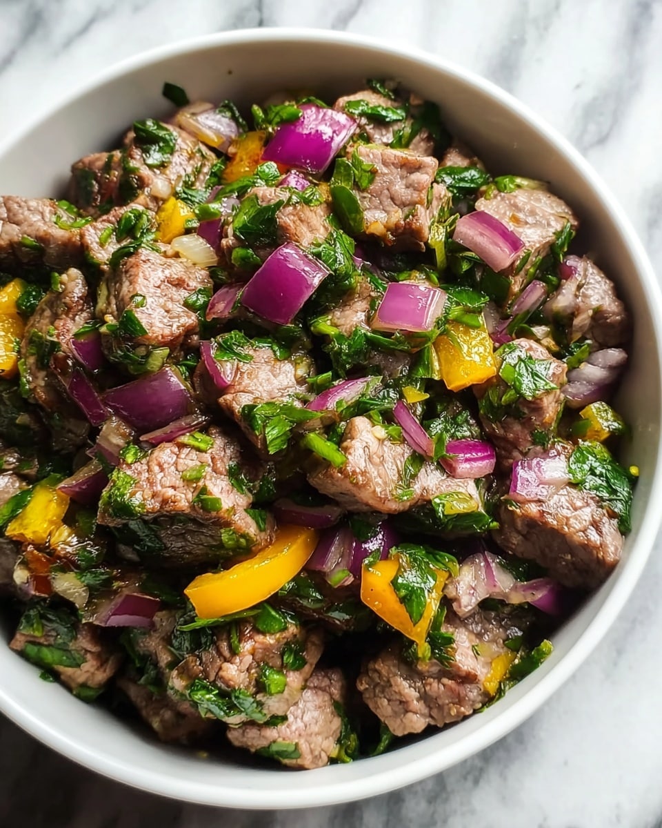The image shows a white bowl filled with cooked beef cubes mixed with chopped green herbs, finely diced purple onion pieces, and small yellow bell pepper chunks. The beef is brownish and slightly textured, while the herbs add a fresh green color scattered evenly throughout. The purple onion pieces are crisp and stand out against the other colors, and the yellow bell pepper adds bright contrast. The bowl is placed on a surface with a white marbled texture photo taken with an iphone --ar 4:5 --v 7