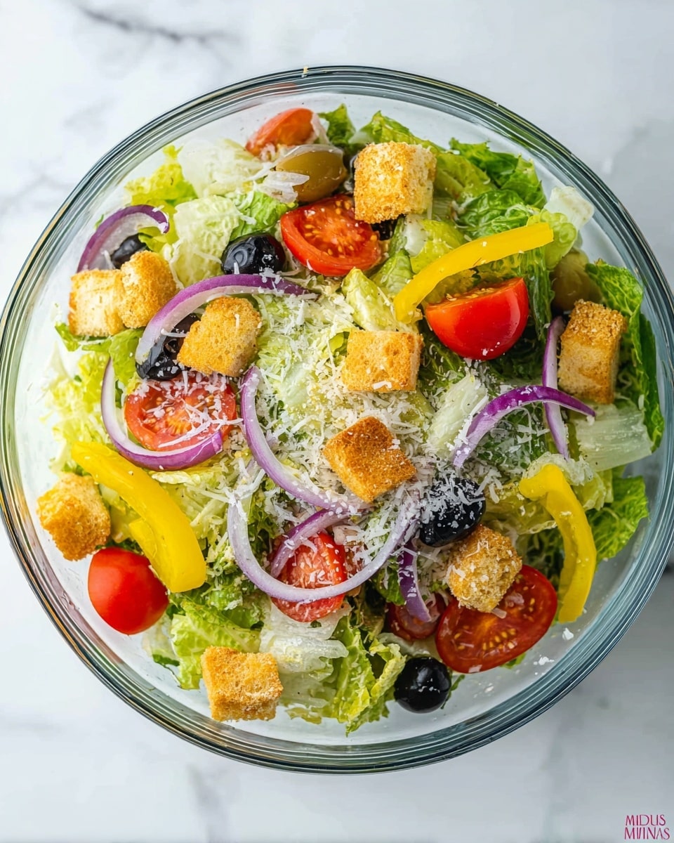 A clear glass bowl filled with a fresh salad sits on a white marbled surface. The salad has a base layer of green lettuce leaves, both light and dark shades, mixed evenly throughout. On top, there are bright red tomato slices, thin rings of purple onion, and whole black olives scattered around. Yellow pepperoncini peppers rest on the salad, adding a pop of yellow. Crunchy golden croutons are spread on top, and the whole salad is lightly sprinkled with white grated cheese. photo taken with an iphone --ar 4:5 --v 7